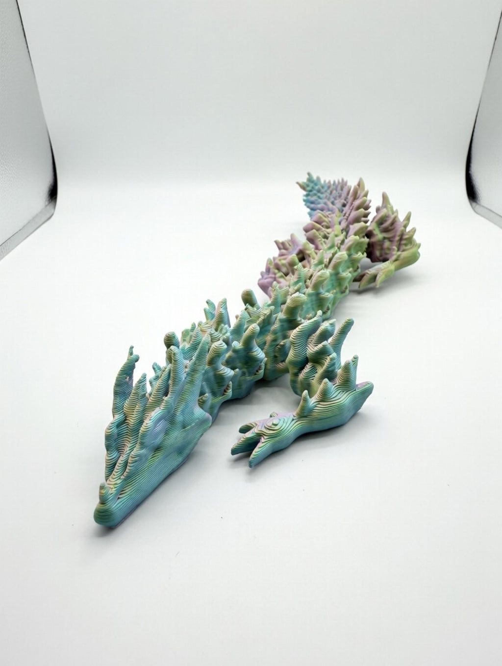 Articulated Spiked Dragon – UV Reactive Pastel 3D Printed Flexi Fidget Toy