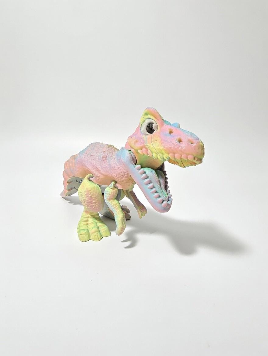 3D Printed Articulated T-Rex – UV Reactive Pastel Fidget Desk Toy