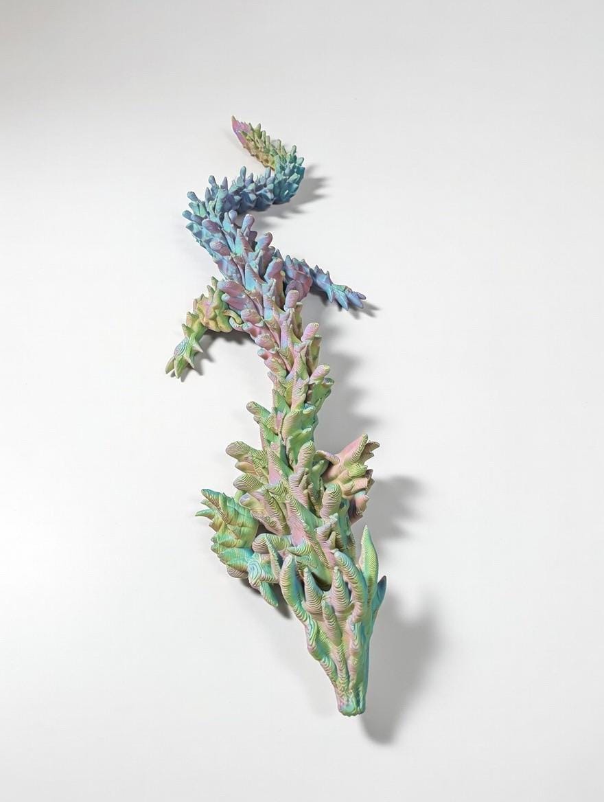 Articulated Spiked Dragon – UV Reactive Pastel 3D Printed Flexi Fidget Toy