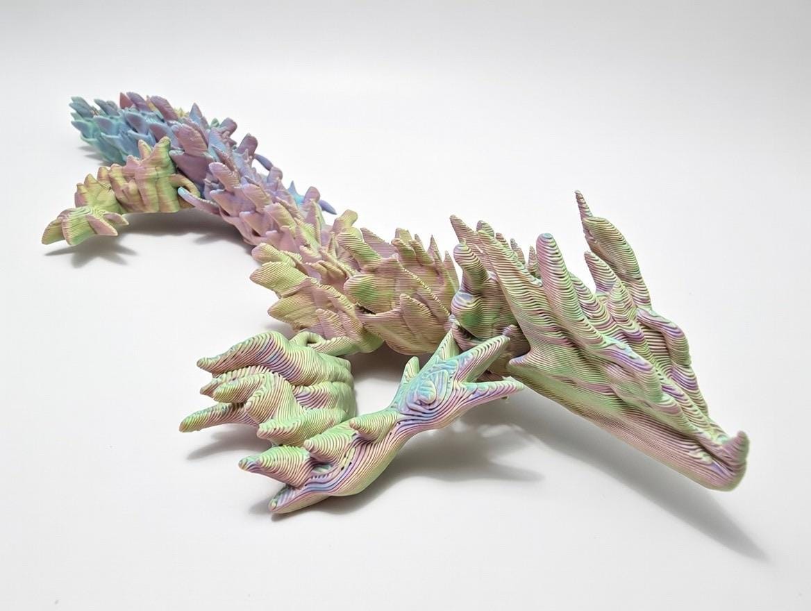 Articulated Spiked Dragon – UV Reactive Pastel 3D Printed Flexi Fidget Toy